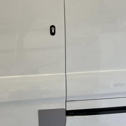 Anti-peel plate installed on van side door