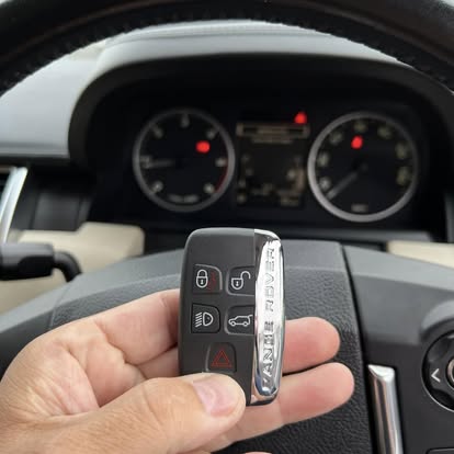 Range Rover smart key held in front of the dashboard after on-site programming